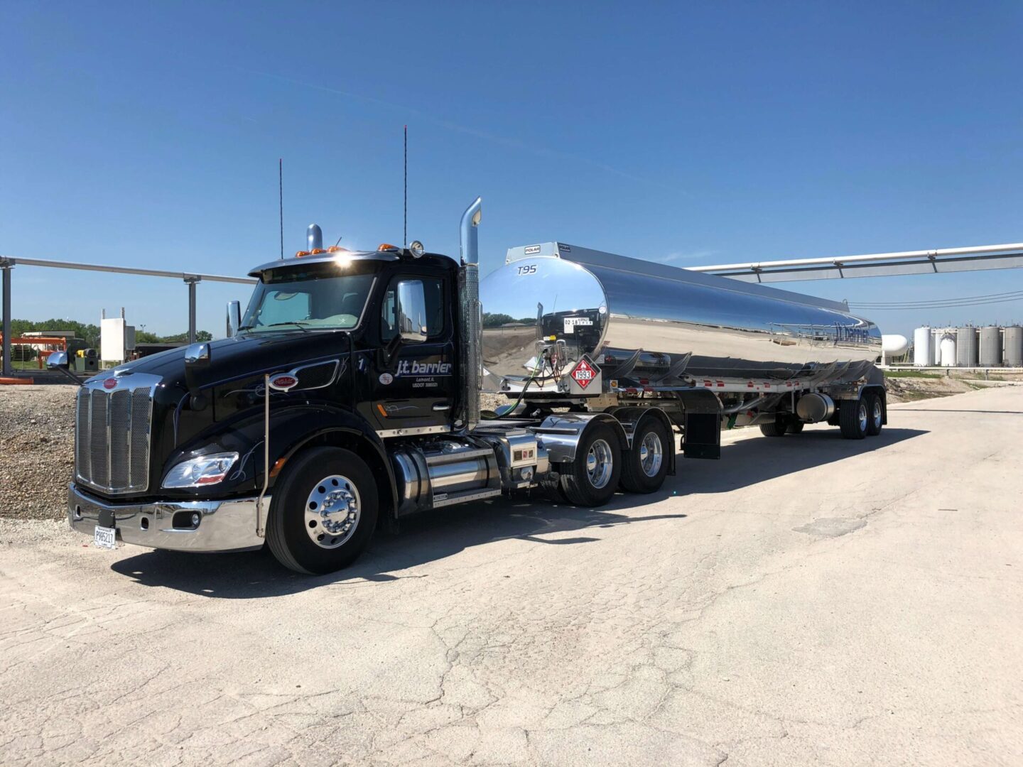 A peterbilt tanker truck parked in a parking lot.