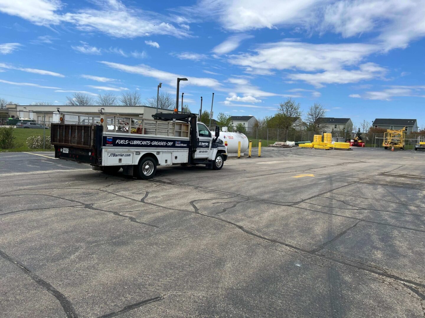 A white truck is parked in a parking lot.